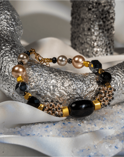 دستبند زنانه شوکا مدل مروارید رزگلد و سنگ مشکی لوکس