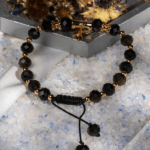 دستبند زنانه اوبسیدین شاین طلایی | آویز صلیب طلایی | شوکا