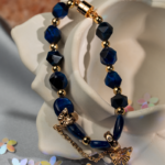 دستبند نوجوان شوکا طرح پروانه سرمهای–طلایی