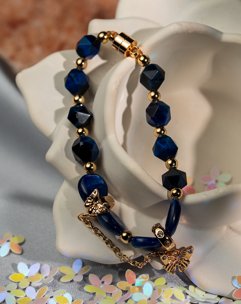 دستبند نوجوان شوکا طرح پروانه سرمهای–طلایی دستبند نوجوان شوکا طرح پروانه سرمهای–طلایی