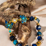 دستبند مهره ای سرمه ای با آویز پروانه